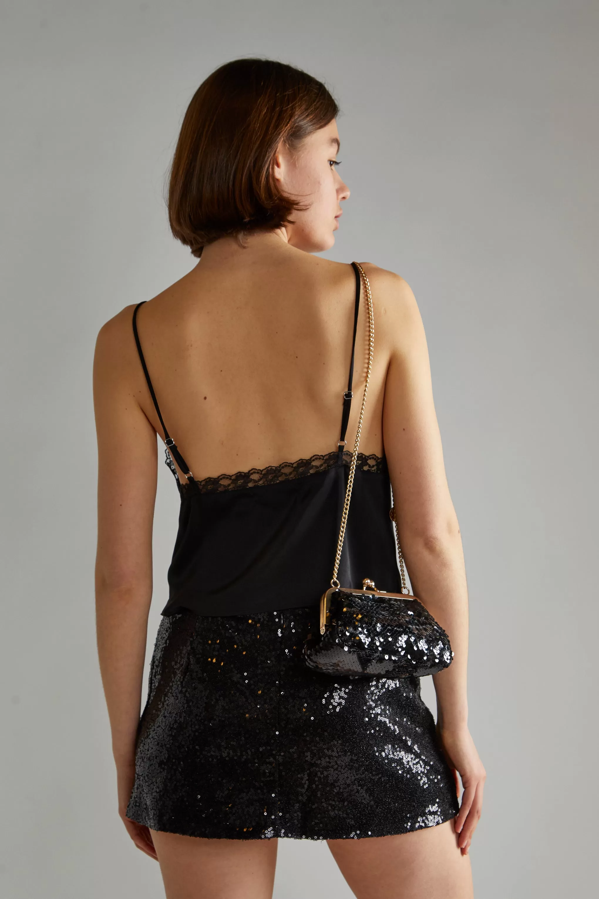 Black-Sequin Peplum Mini-Skirt